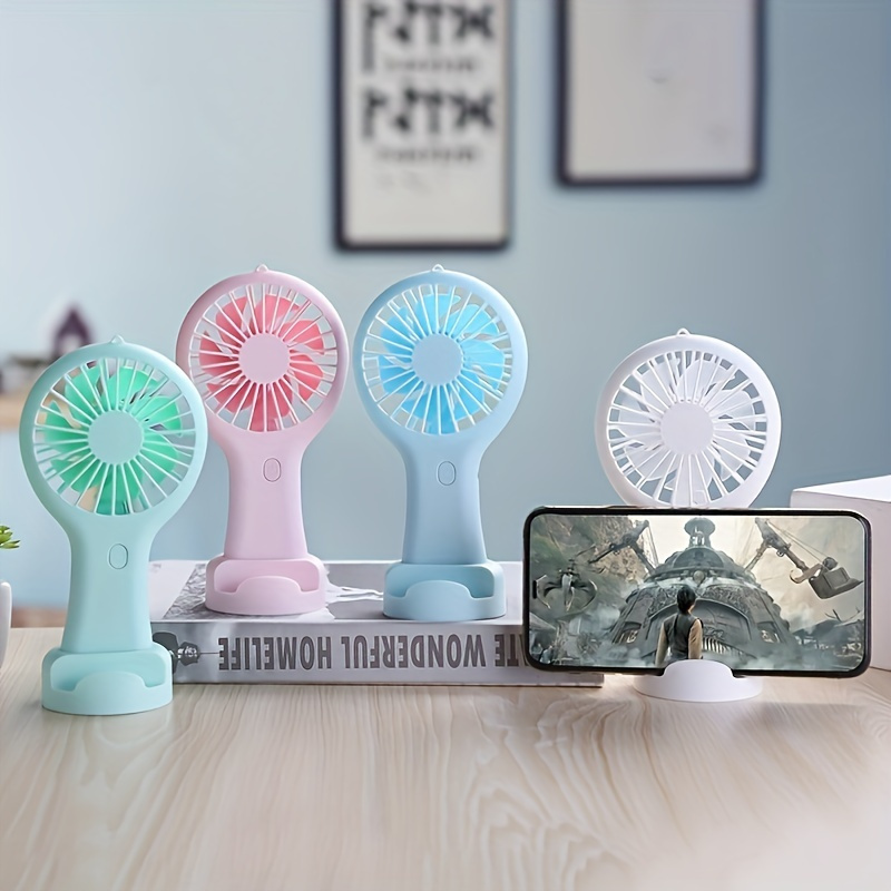 Portable Usb Rechargeable Handheld Fan With Mobile Phone Stand, Ideal For Outdoor Travel, Cooling Accessory
Portable Usb Rechargeable Handheld Fan With Mobile Phone Stand, Ideal For Outdoor Travel, Cooling Accessory