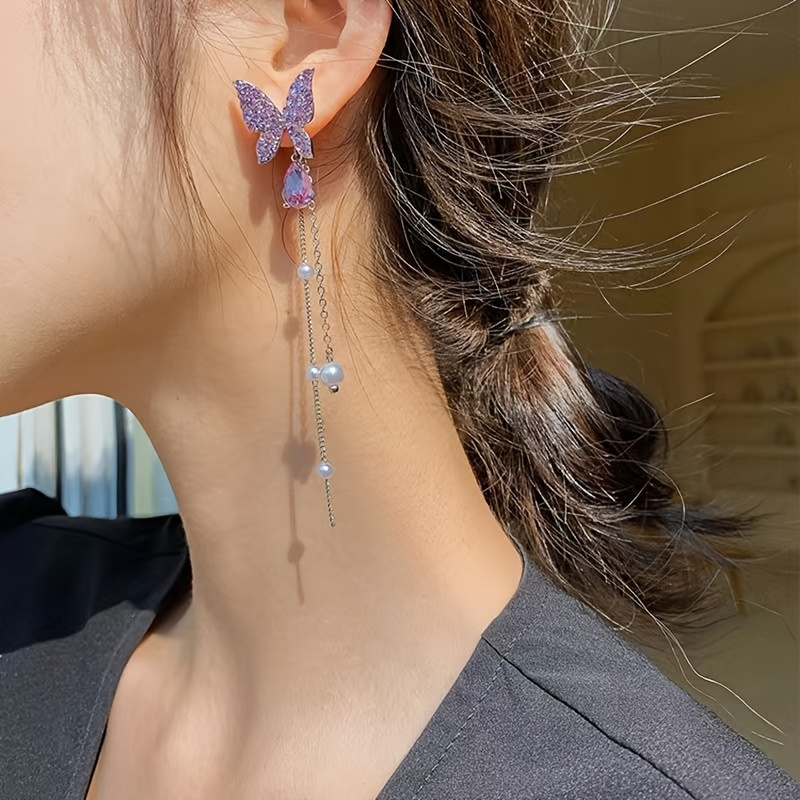 Boucles d'oreilles papillon à pampilles, style élégant et mignon, boucles d'oreilles pendantes avec fausses perles et strass, bijoux d'oreilles longs et doux.
Boucles d'oreilles papillon à pampilles, style élégant et mignon, boucles d'oreilles pendantes avec fausses perles et strass, bijoux d'oreilles longs et doux.