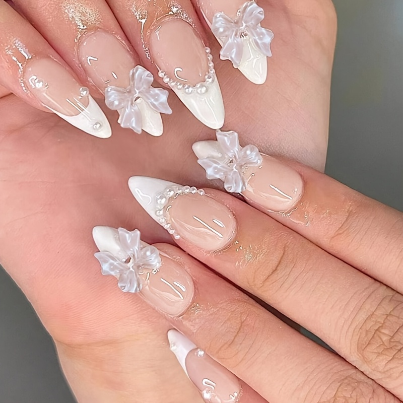 Ensemble de 24 ongles pressés en d' française, avec des pointes blanches ornées de nœuds et de perles 3D, chic et sophistiqué, et .
Ensemble de 24 ongles pressés en d' française, avec des pointes blanches ornées de nœuds et de perles 3D, chic et sophistiqué, et .
