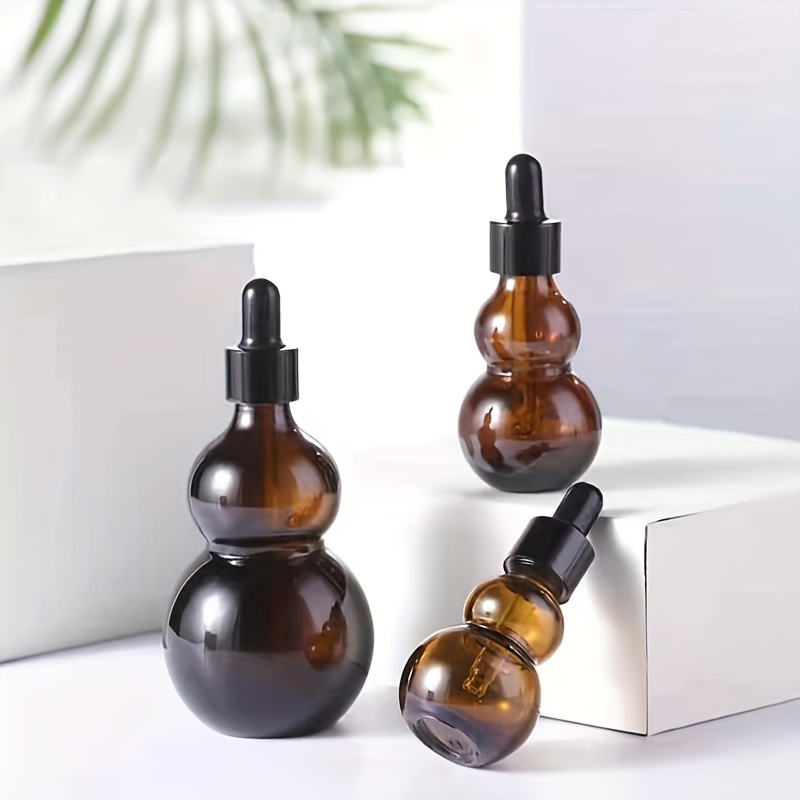 1pc Gourd Shape Dropper Bottle, 10/20ml Empty Bottles With Eye Dropper, For Essential Oils & Perfume, Refillable Travel Accessories
1pc Gourd Shape Dropper Bottle, 10/20ml Empty Bottles With Eye Dropper, For Essential Oils & Perfume, Refillable Travel Accessories