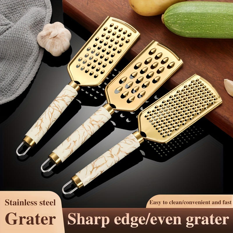 3/1pc Grater Stainless Steel Household Kitchen Grater Onion Ginger Melon Fruit Vegetable Cheese Grater Handle Held Without Hurting Hands, Golden , Luxury
3/1pc Grater Stainless Steel Household Kitchen Grater Onion Ginger Melon Fruit Vegetable Cheese Grater Handle Held Without Hurting Hands, Golden , Luxury