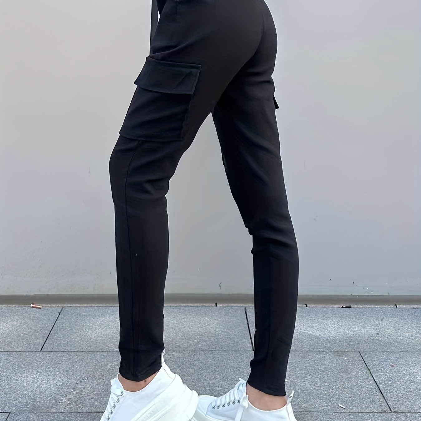 Image of Women's High-waisted Casual Cargo Pants - Black, Slim Fit, Stretch Fabric With Pockets, Elastic Waistband, Wear