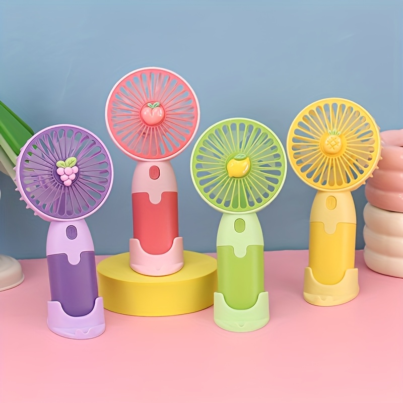 Un mini ventilador portátil recargable USB para estudiantes, adecuado para uso en exteriores y de escritorio,…: retailer-supplied image