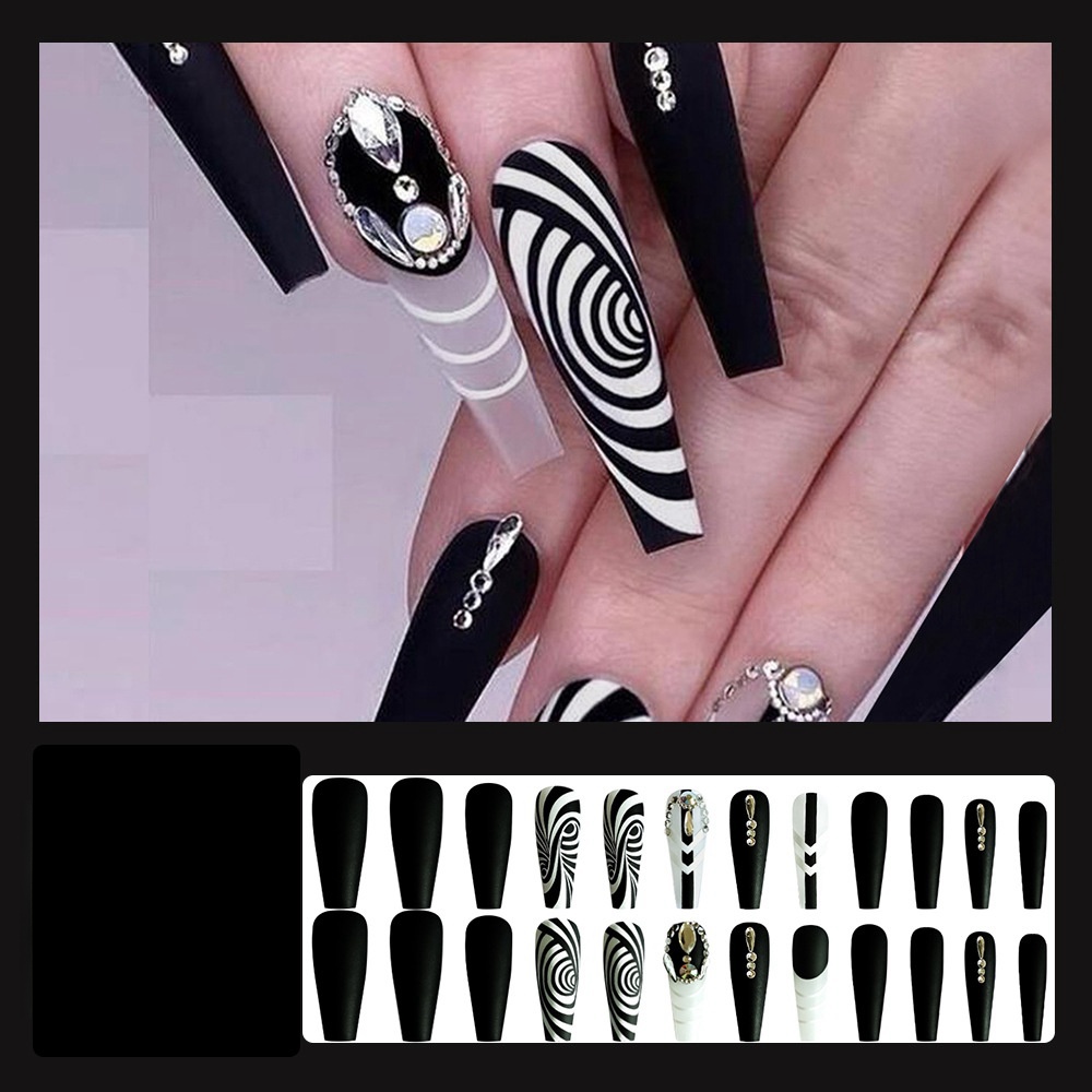 

24 Long Nails In Black And White Zebra Print With Beautiful Lines And Glamour. Jelly Gel And Liquid Gel Included. For The Sophisticated Girl.