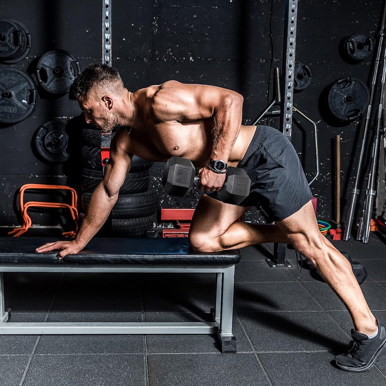 Man exercising with hex dumbbells in a gym setting