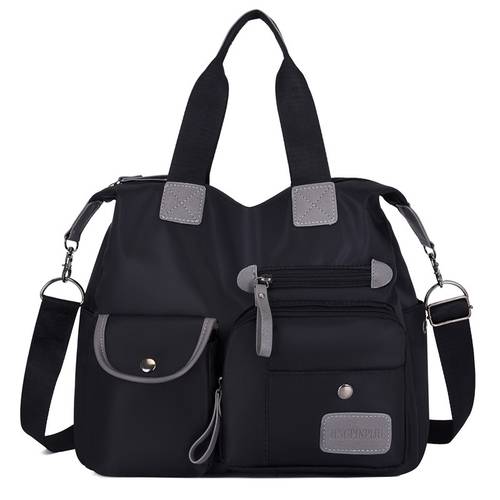 imagem do item bolsa tote feminina uso de mão e com múltiplos compartimentos alça extra ajustável espaçosa para uso diário