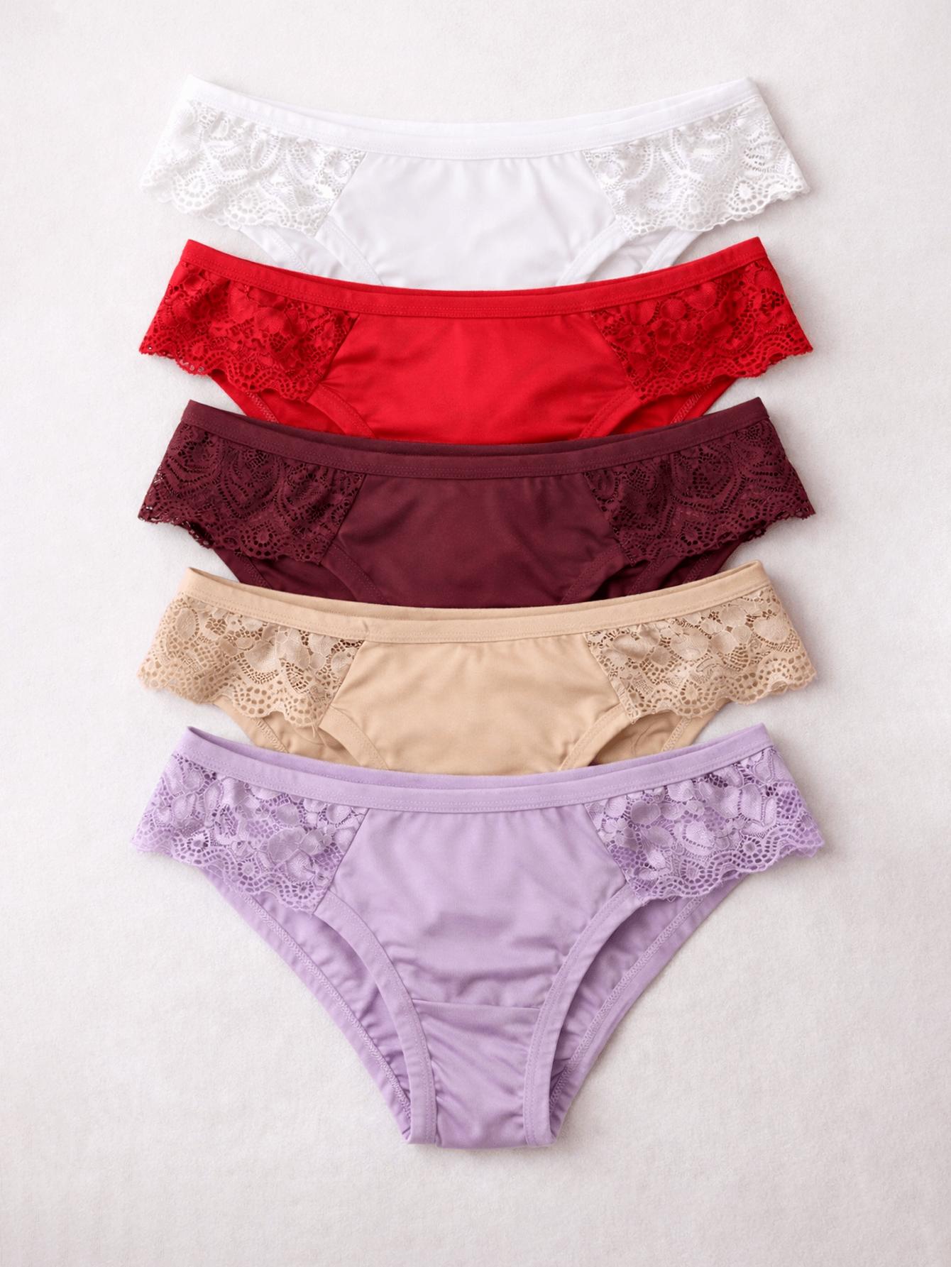 Kit com 5 calcinhas tanga em cores variadas (branco, vermelho, vinho, bege e lilás), empilhadas verticalmente com detalhes em renda.