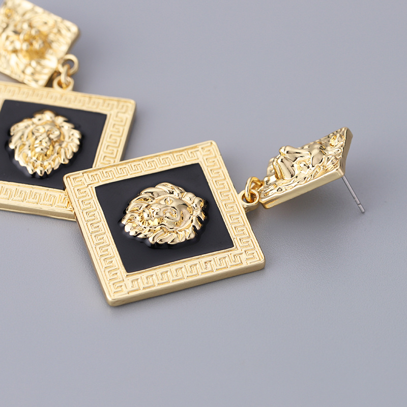 Gold lion clearance head earrings