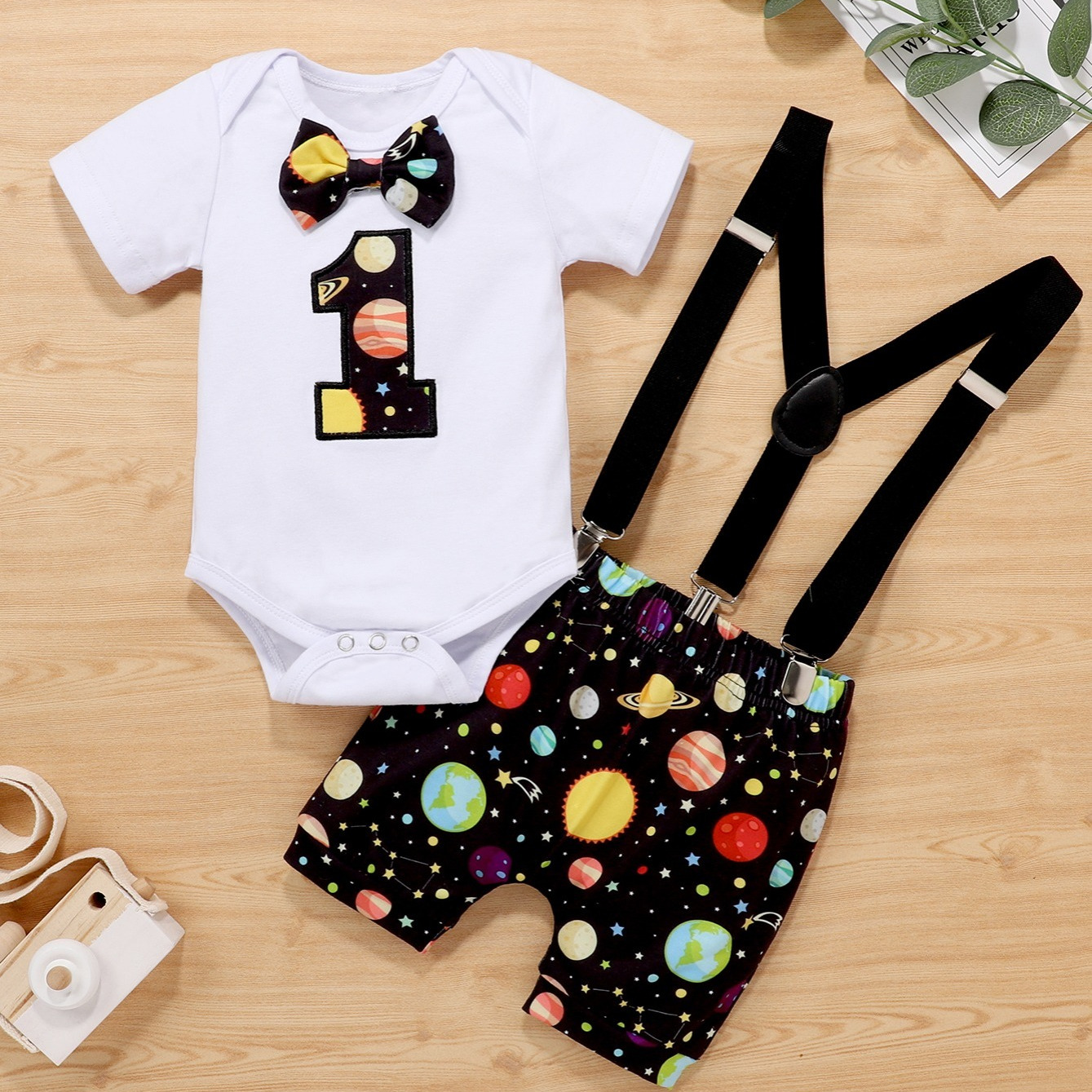 

Infant Boys 1st Birthday Short Sleeve Romper & Planet Print Suspender Shorts Set