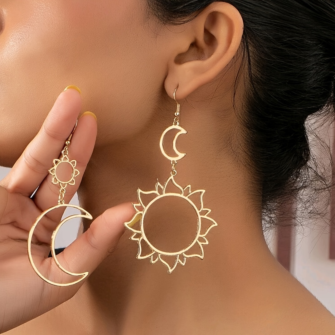 

A Pair Of Creatively Asymmetric Earrings With Dangling And Moon.