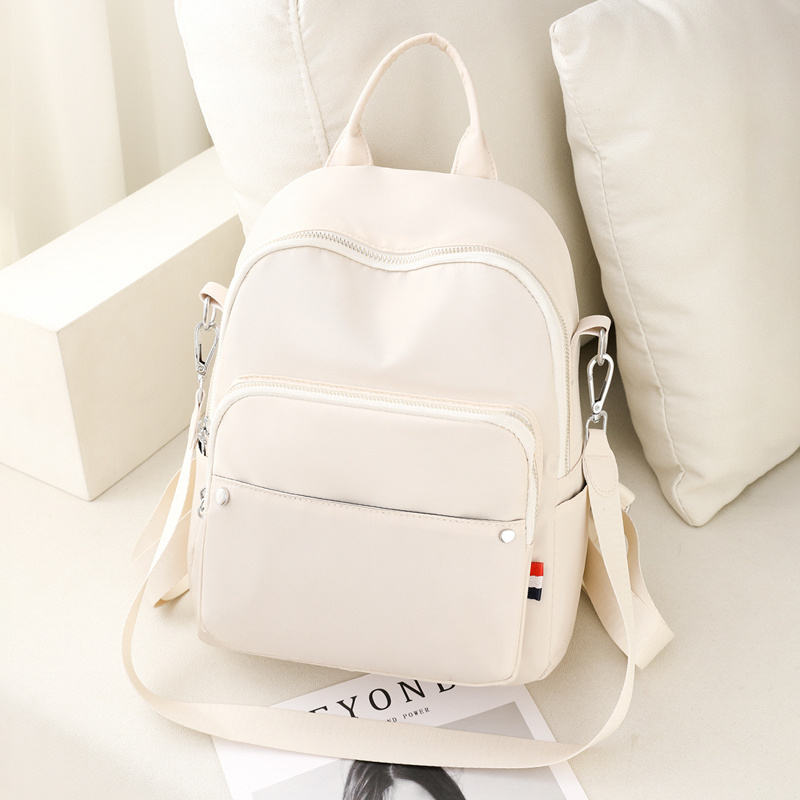 Beige on sale backpack purse