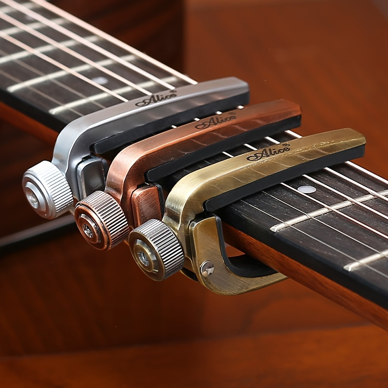 

Guitar Capos Electric Acoustic Guitar Capo Bass Violin Ukulele Capotraste Single-handed Tune Clamp Trigger