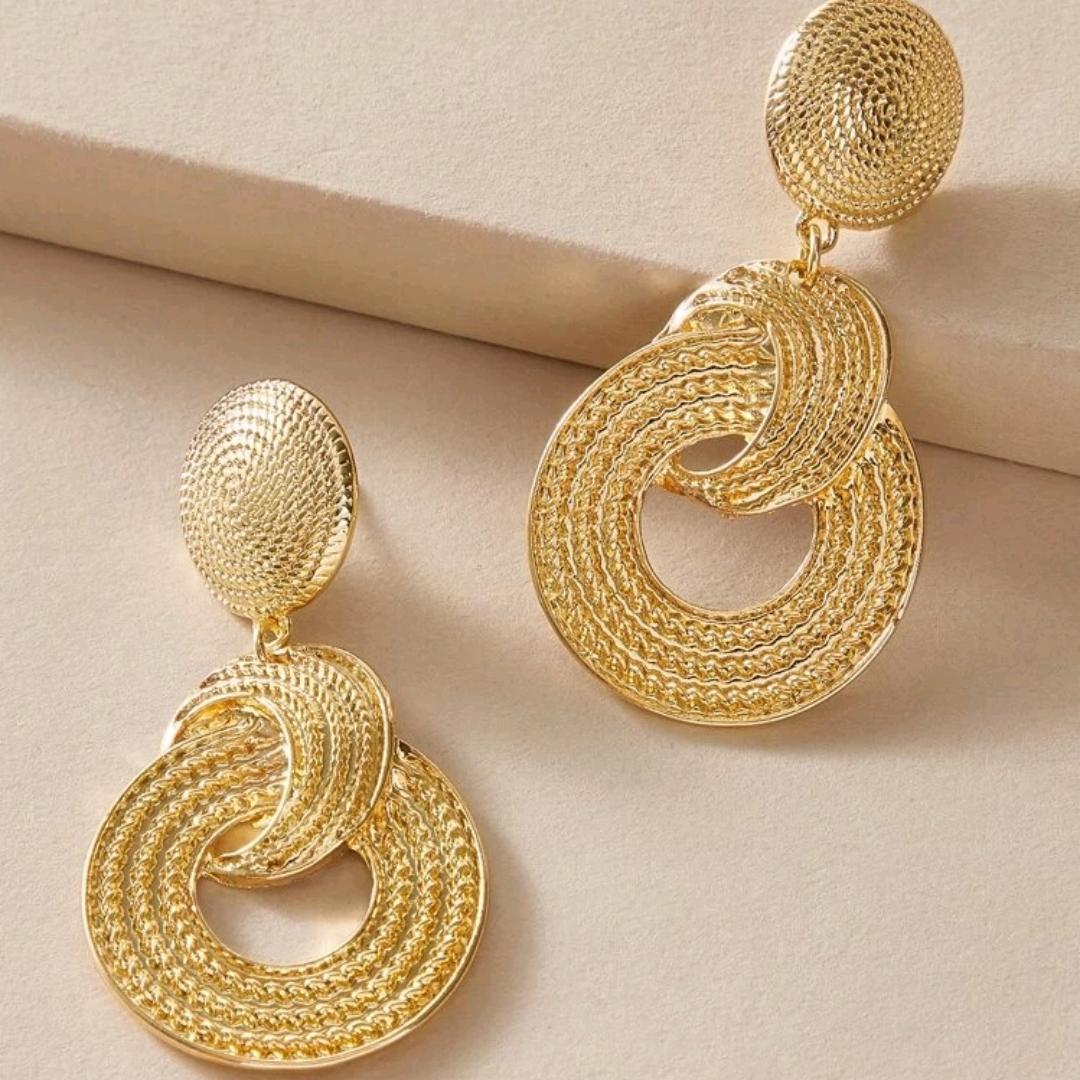 A Pair Of Golden Geometric Circle Drop Earrings