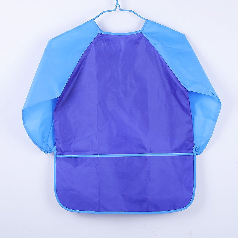 DELANTAL IMPERMEABLE DINOS CON LIBRETITA - Mapi bebe