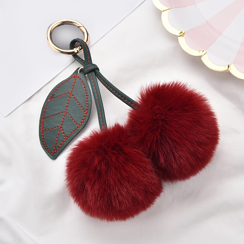 

Adorable Fluffy Cherry Keychain - A Perfect Accessory For Your Car Or Handbag!