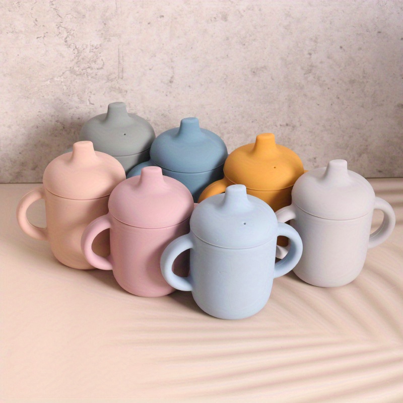 Tasse d'apprentissage pour que bébé apprenne à boire seul sans se mouiller  - Cubes & Petits pois