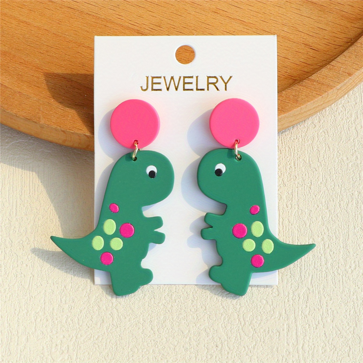 A Pair Of Women's Printed Green Dinosaur Acrylic Earrings With A Clay Texture