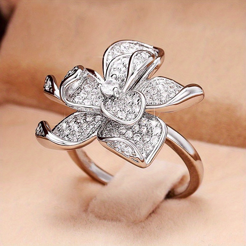 Image of A Luxurious Floral-shaped Ring For Women, Featuring Synthetic Zirconia Stones, Perfect For Engagement And Stylish Jewelry