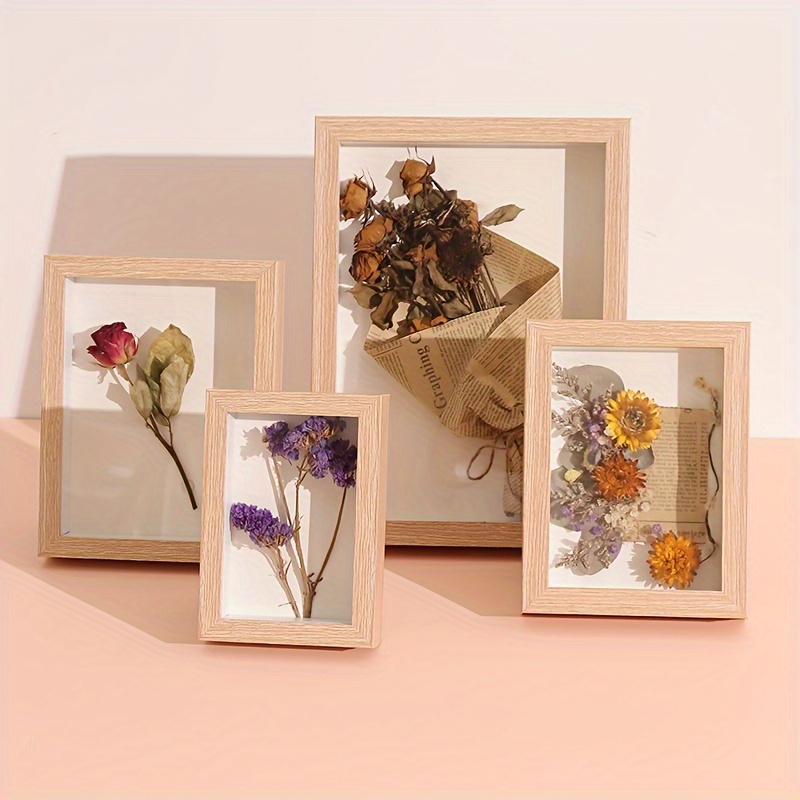 An Empty Square Frame Covered with Polymer Clay Flowers on Solid