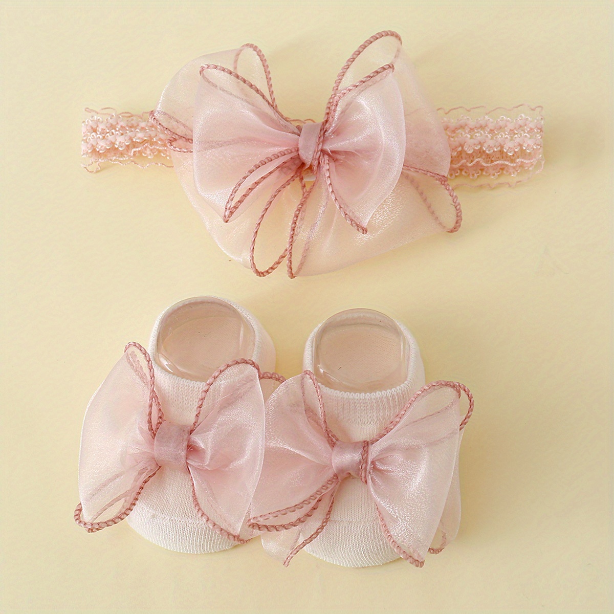 Image of 1 Pair Of Large Lace-knotted Children's Socks And 1 Baby Headband