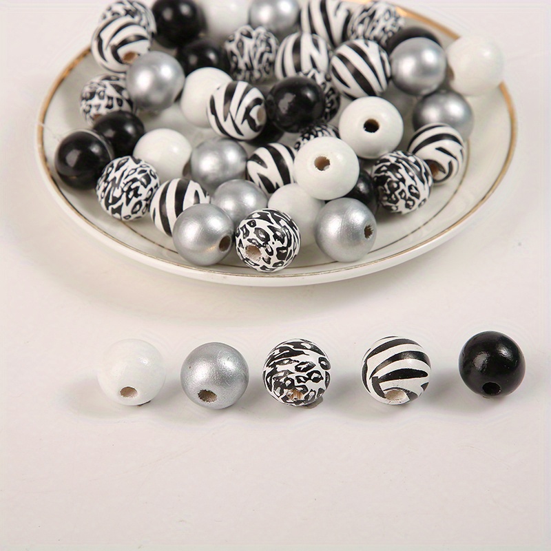 A Set Of Wooden Beads Featuring Cow Patterns, Pumpkin Faces, And Printed Designs, Along With Jute Rope For Tassel Home Additions, Containing 50 Beads Per Pack