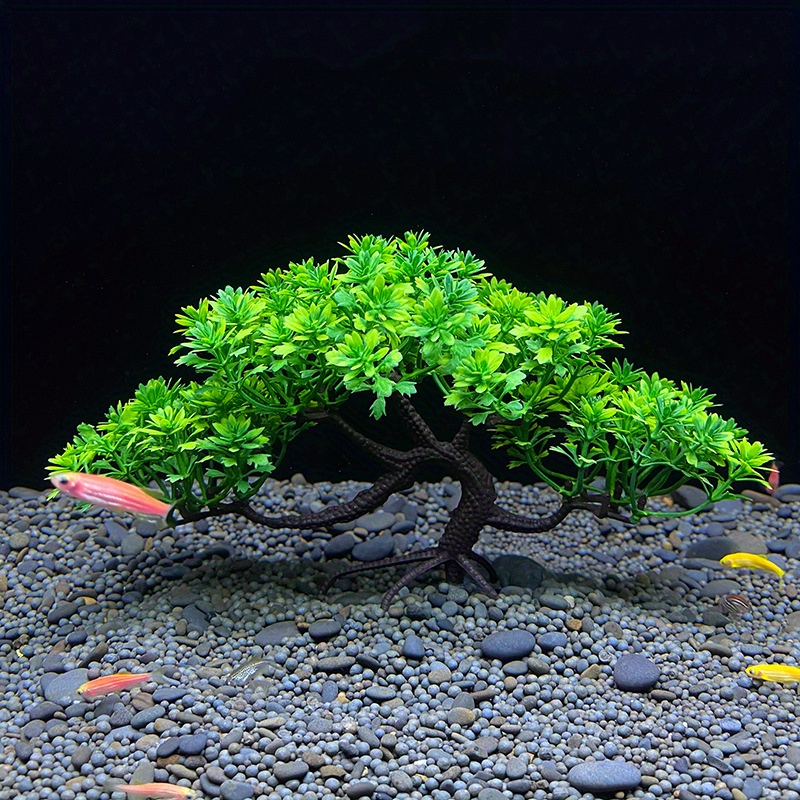 Bring Nature Indoors: Add A Touch Of Greenery To Your Fish Tank With Artificial Plastic Plants