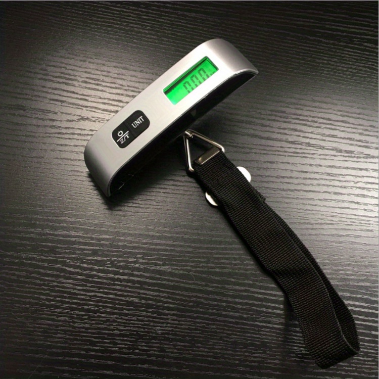 A Tool For Measuring The Weight Of Luggage When Traveling, With A Portable Digital LCD Display, Capable Of Weighing Up To 110lb/50kg.