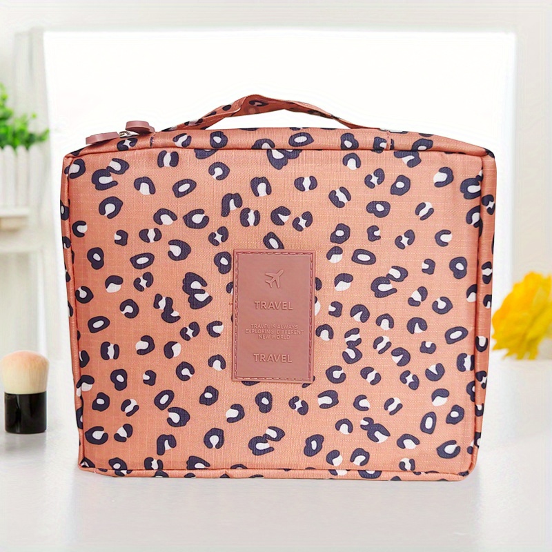 TOILETRY BAG WITH A MULTICOLOURED PRINT - Orange