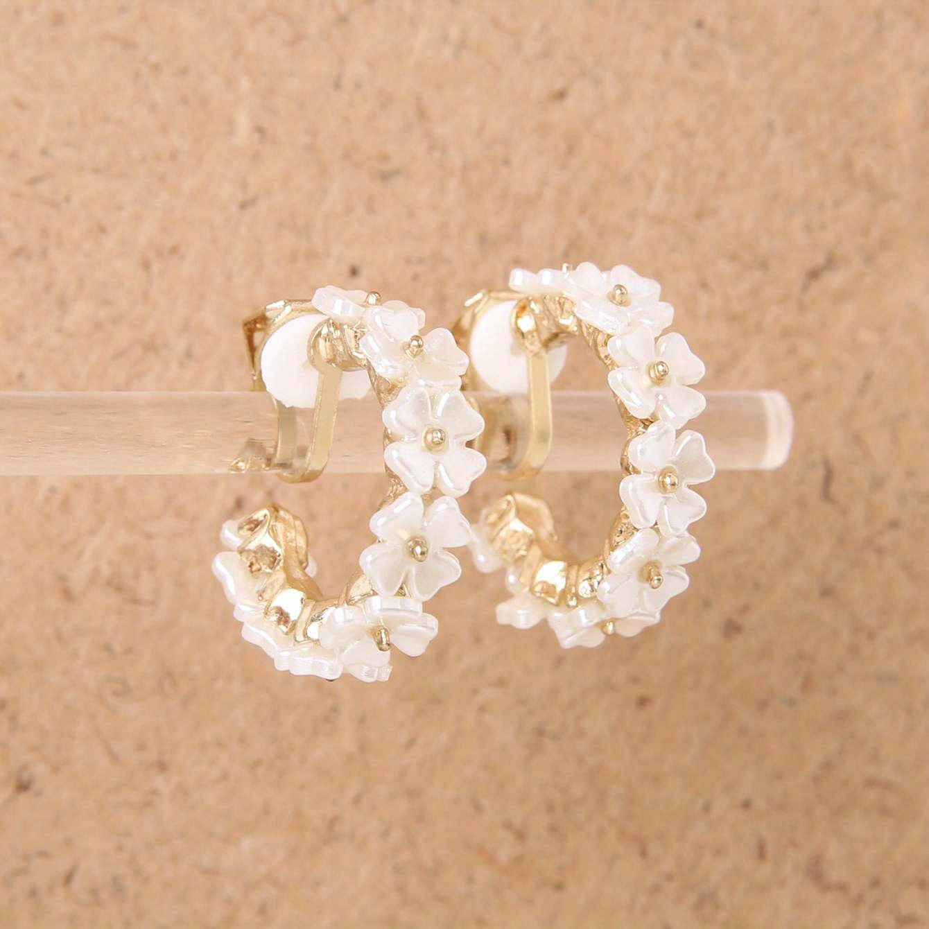 A Pair Of Round Ear Clips For Women With Flowers