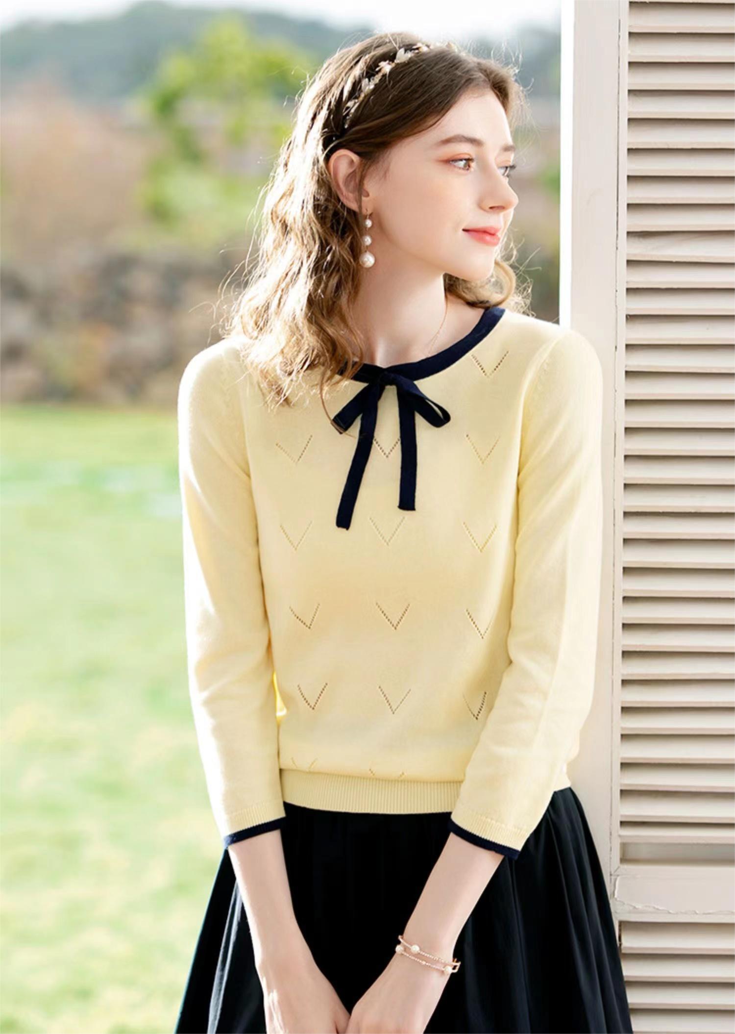 Sweater with bow clearance sleeves