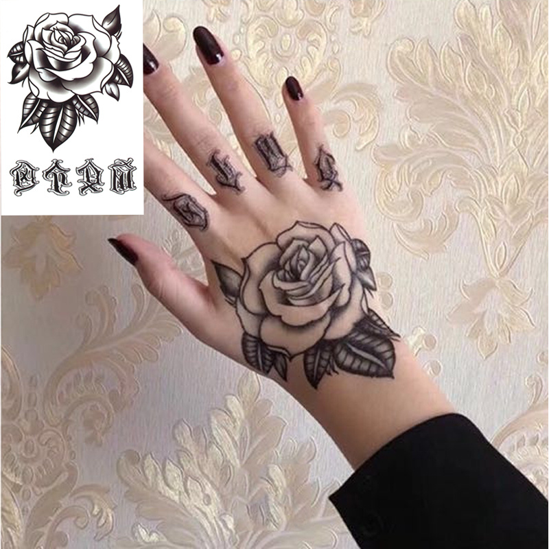 Black rose on a hand by tototatuer  Tattoogridnet
