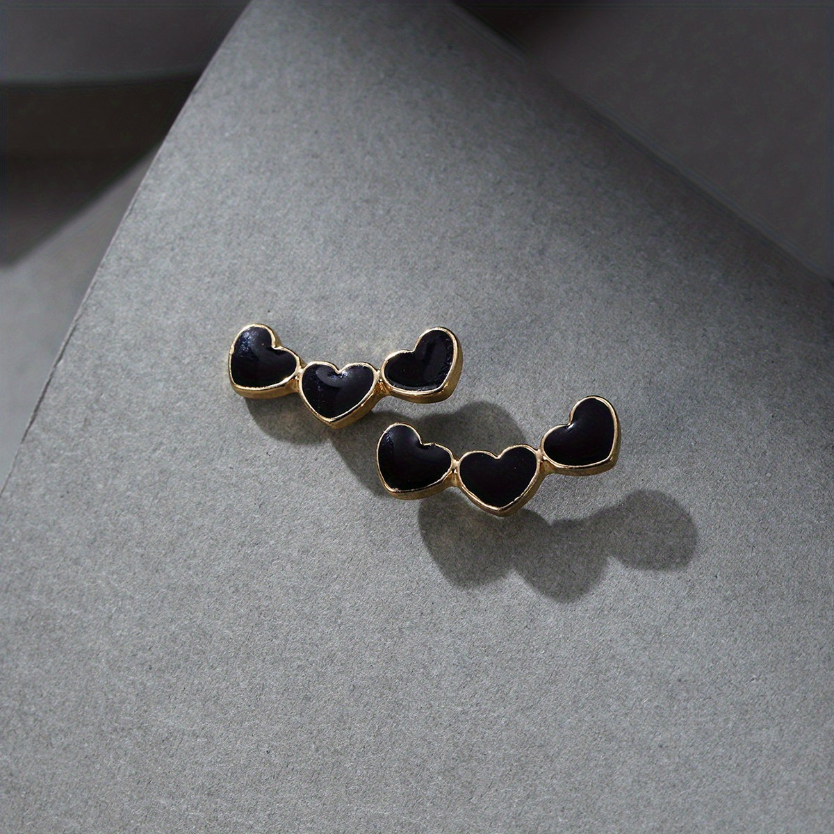 Pair Of Black Heart Stud Earrings