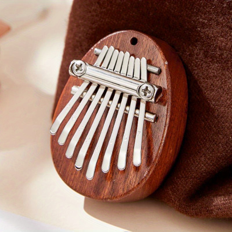 8-Key Mini  Exquisite Finger Thumb Piano Musical Good Accessory Pendant Gift