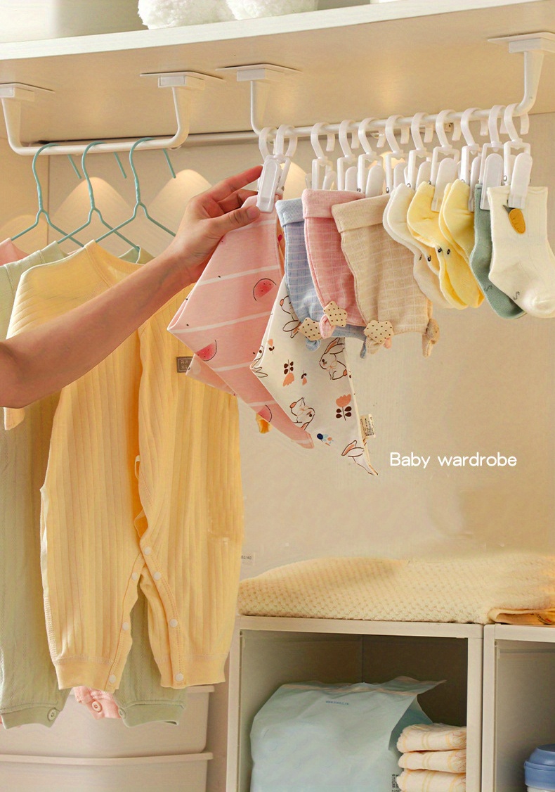 Hangers Baby Clothes Rack Wardrobe Closeup Stock Photo by