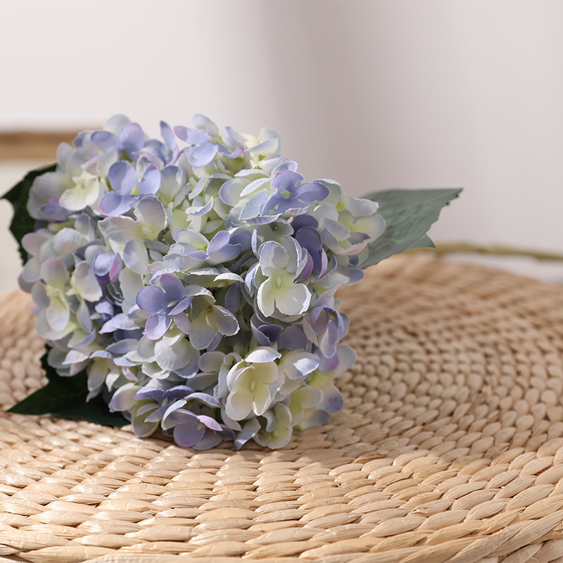 artificial flowers with small ceramic vase