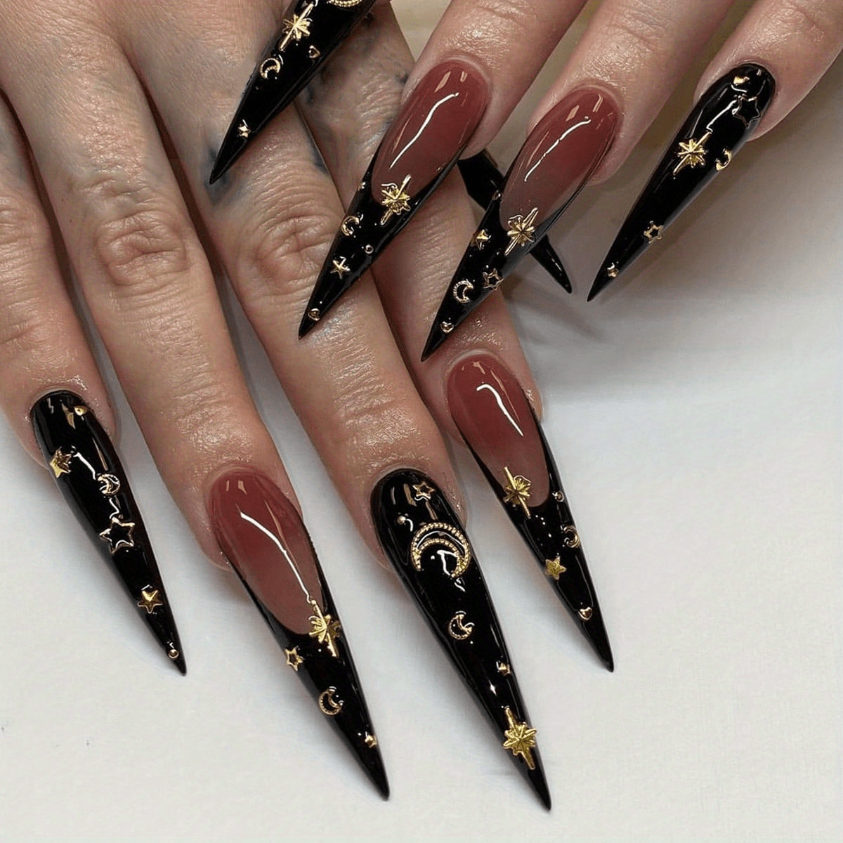 red and gold stiletto nails