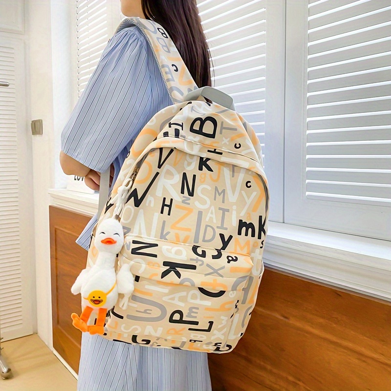 New Style Simple Large-capacity Schoolbag, Girls Junior High School  Students Cute Letters Pattern Backpack, College Students Commuter Portable  Folding Backpack With Cute Pendant - Temu