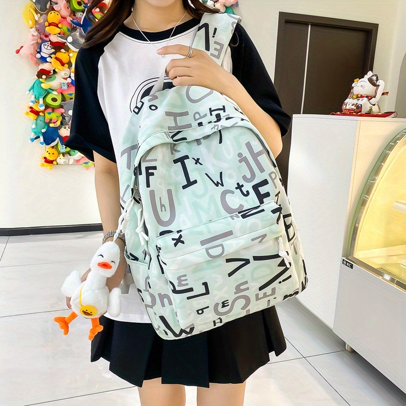 New Style Simple Large-capacity Schoolbag, Girls Junior High School  Students Cute Letters Pattern Backpack, College Students Commuter Portable  Folding Backpack With Cute Pendant - Temu