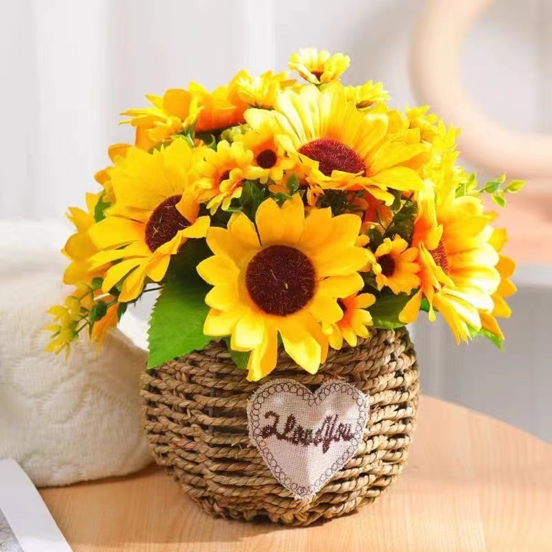 Vase with beautiful sunflower in wicker basket and bottle of orange juice  on wooden table Stock Photo - Alamy