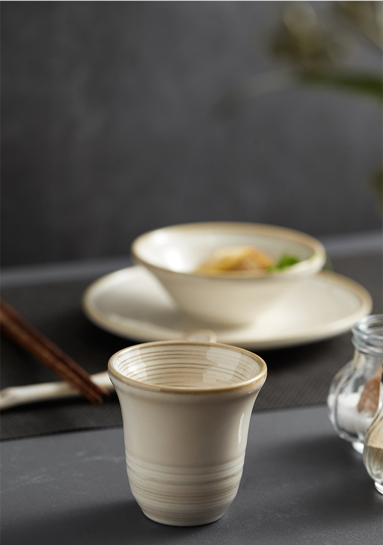 Tea service on a white table : Iron kettle, tea cup with hot tea, a soup  bowl & special spoon. Beautiful typical chinese restaurant Stock Photo -  Alamy