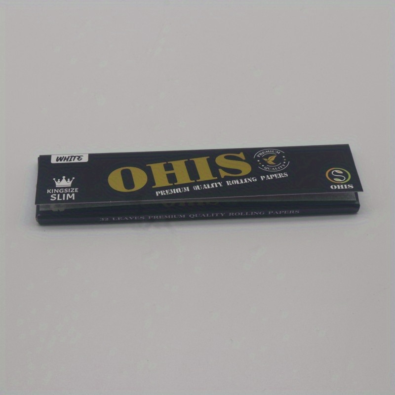 Smoking White rolling papers in a 1 1/4 size