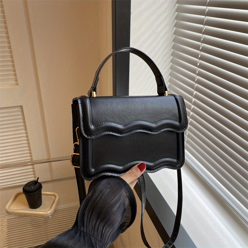 Minimalist Black Leather Crossbody Bag with Magnetic Closure