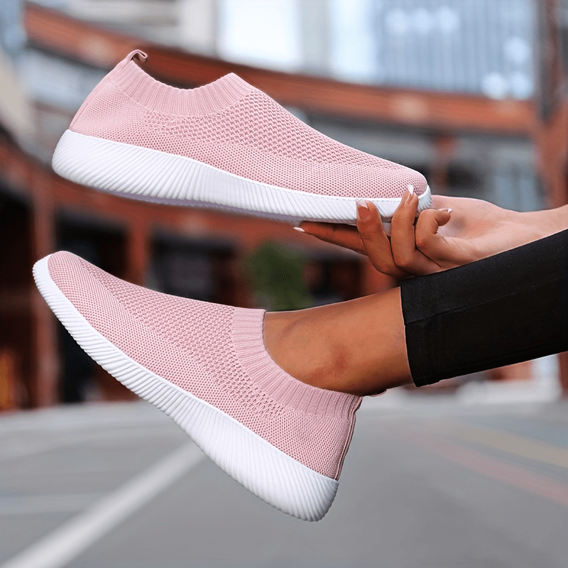 Womens pink and sales black sneakers