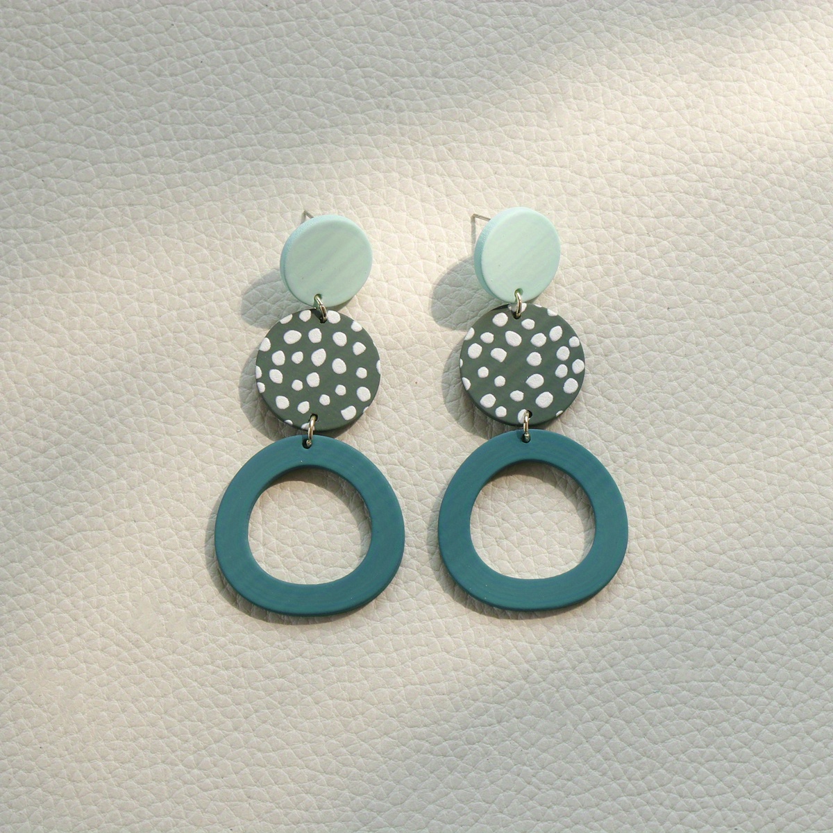 Image of A Pair Of Long, Round Geometric Fashion Earrings Made Of Acrylic, Suitable For Women To Wear At Parties Or Daily