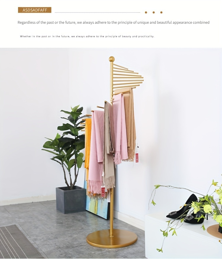 elegant golden metal scarf towel rack freestanding rotating display stand for shawls ties belts with fringe detail ideal for clothing stores   details 3