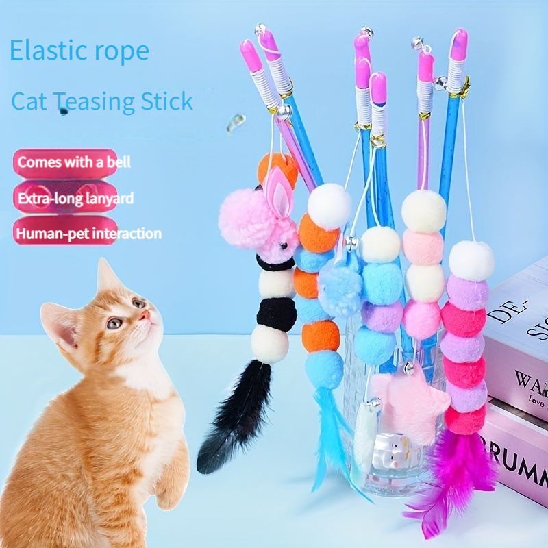 

Interactive Cat Teasing Stick With Rope, Cartoon Patterned Plastic Toy With Extra-long Lanyard, Feather & Pom Pom Pendant, No Battery Required