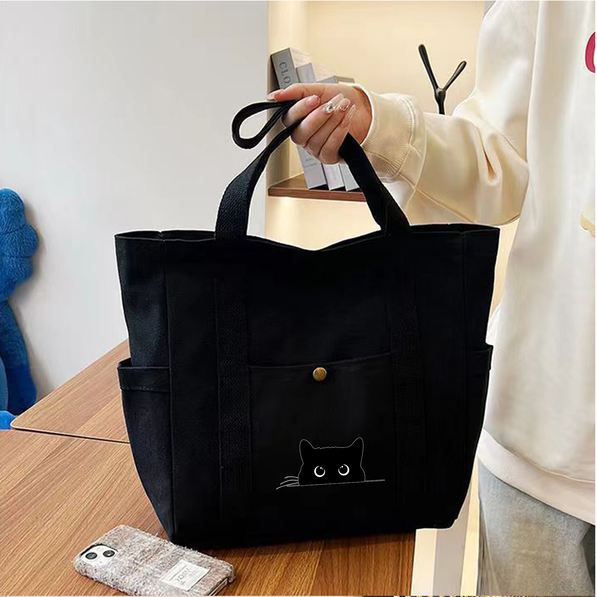 TEMU 【大容量】ペット好きのためのキャンバス製トートバッグ - かわいい猫の輪郭デザインと遊び心のある大きな目が特徴のショルダーバッグ。複数のコンパートメントで整理しやすく、丈夫で耐摩耗性があります。