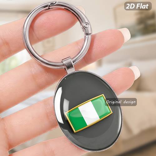 imagen del artículo 1 llavero con diseño de de de nigeria y acabado de lujo con dorado. para de la y festivales en , como accesorio para internacionales y extranjeros, mostrando y