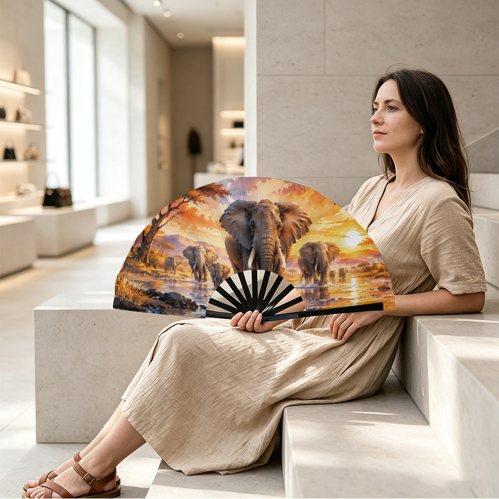TEMU A Women's Folding Hand Fan Featuring A Pattern Of An Elephant Herd Migrating At Sunset. A Stylish Folding Fan, Fu Fan Accessory, With A