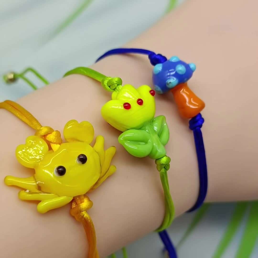 Glass Bead Bracelet with Yellow Flower Charm & Green Beads